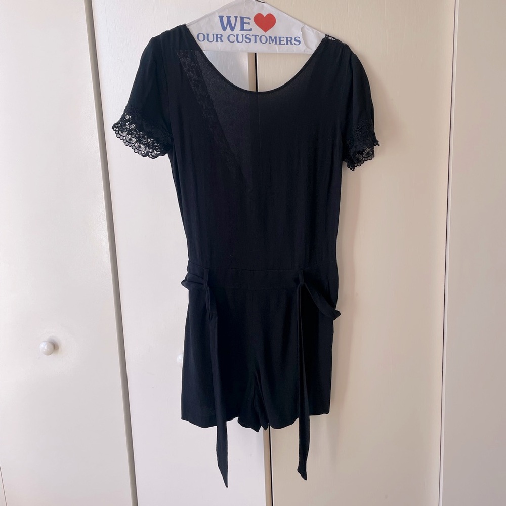 Sezane jumpsuit with an open back and pockets